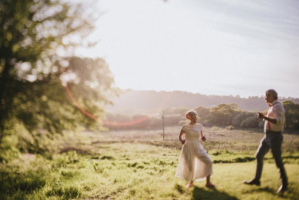 Couple dance in field at Fforest Farm wedding