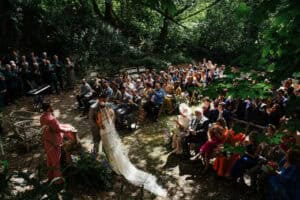 WEDDING CEREMONY IN THE QUARRY AT FFOREST FARM, CILGERRAN